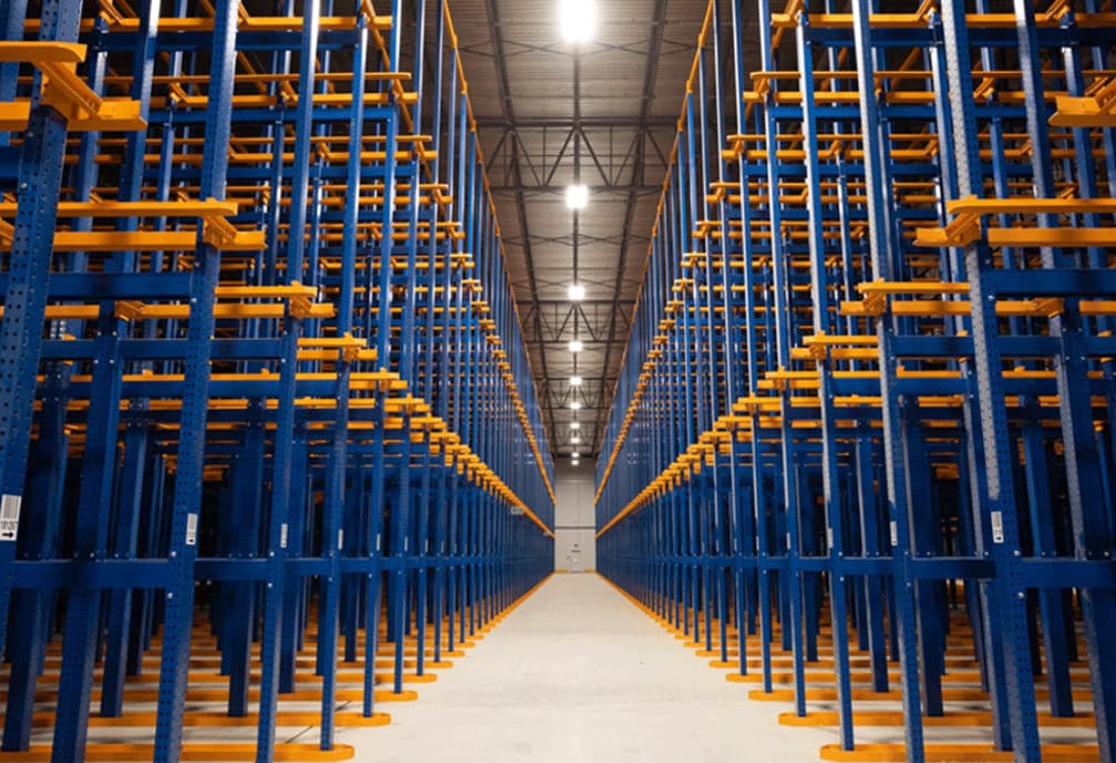 Drive-In/Drive-Through Rack system with pallets stored in a high-density configuration